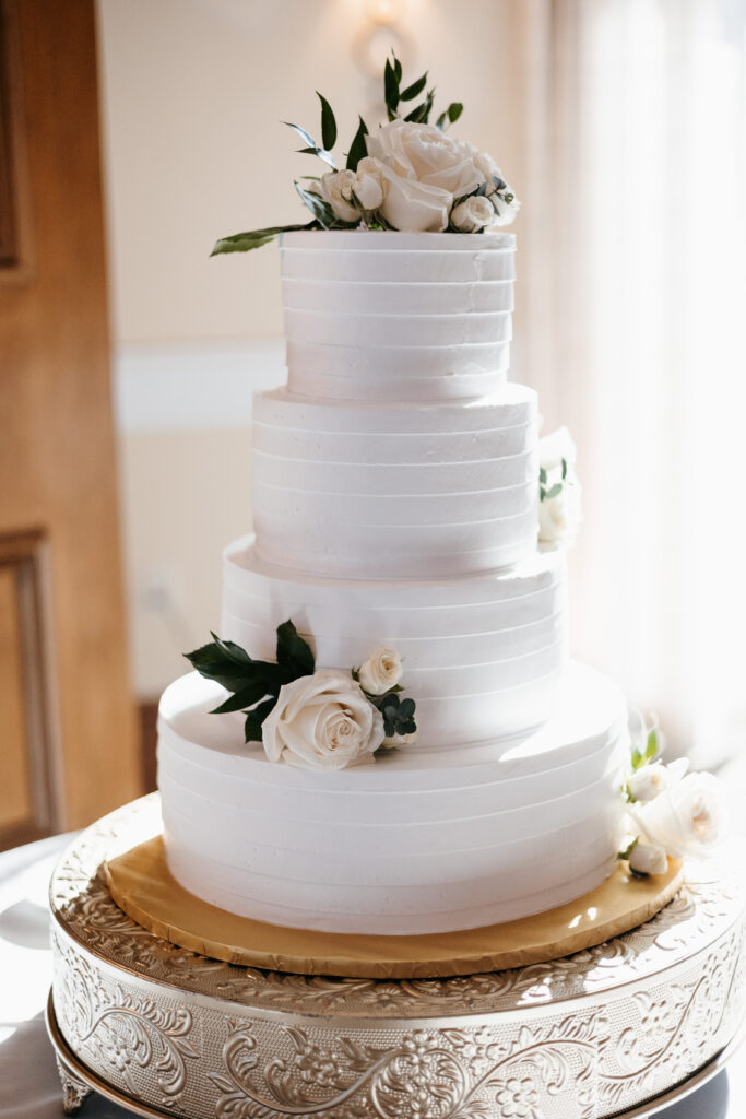 Elegant cake inside reception are during wedding at Heritage Bay Golf and Country Club in Naples, Florida. 