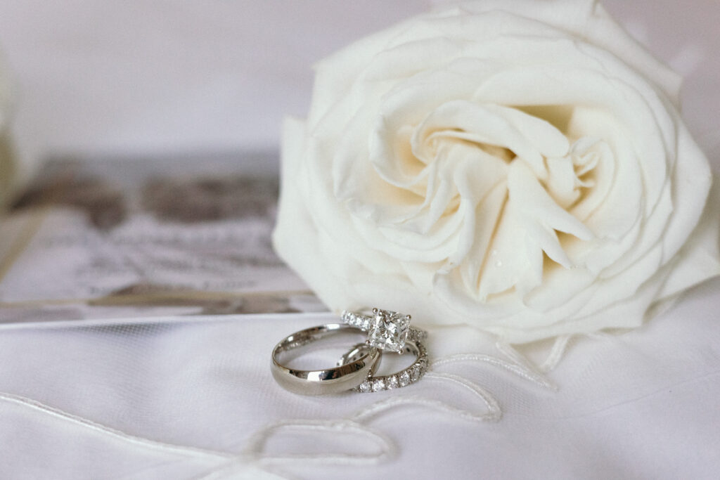 Detail shots of wedding ring and florals during wedding day at The Ritz-Carlton Resort in Naples, Florida. 